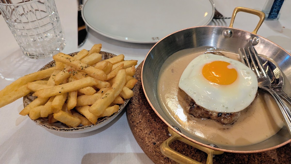 Steak with fried egg and fries